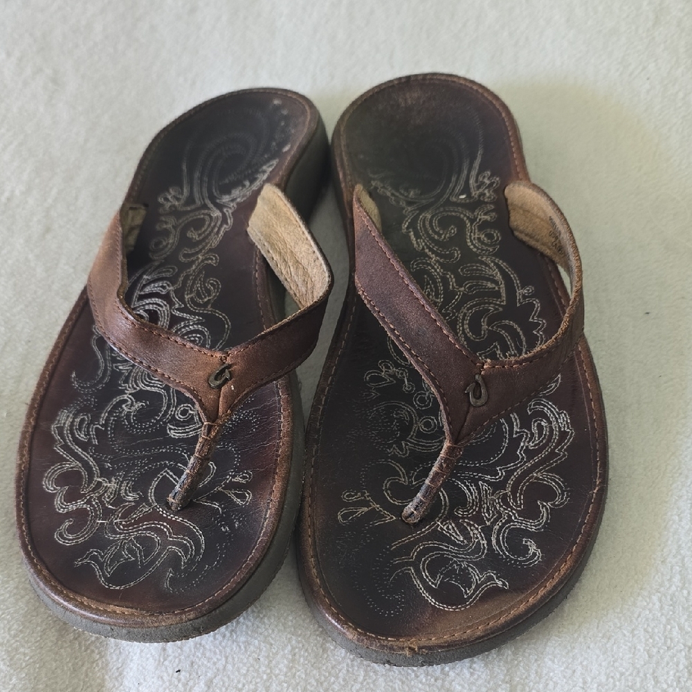 Olukai Brown Leather Flip Flops with Embroidered Design